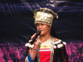 Image: Yao girl on stage in traditional costume - Click to Enlarge