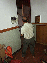 Image: Baba shaving the front door - Click to Enlarge